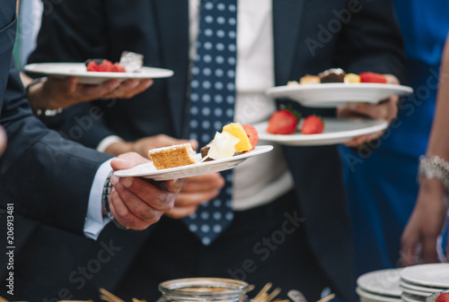 people with varied sweets in the dishes  concept hospitality  bars and restaurant