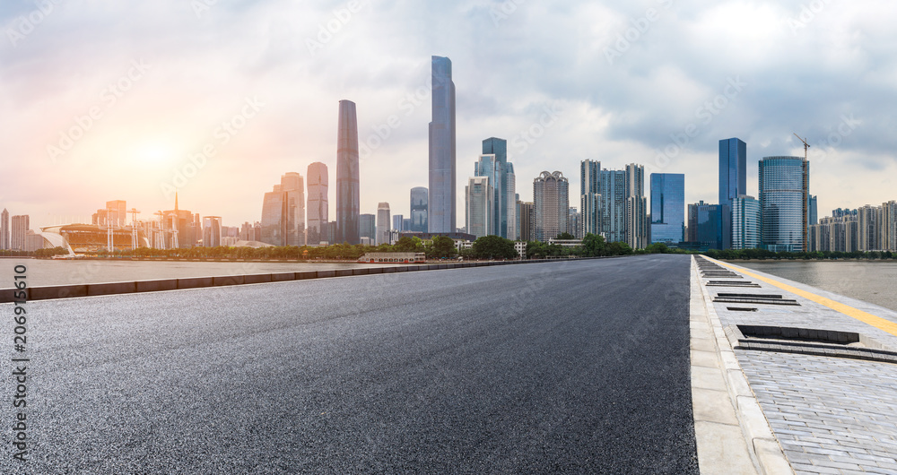 asphalt road and modern city skyline in Guangzhou at sunset,China asphalt road and modern city skyline in Guangzhou at sunset,China