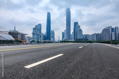 asphalt road and modern city skyline in Guangzhou at dusk China