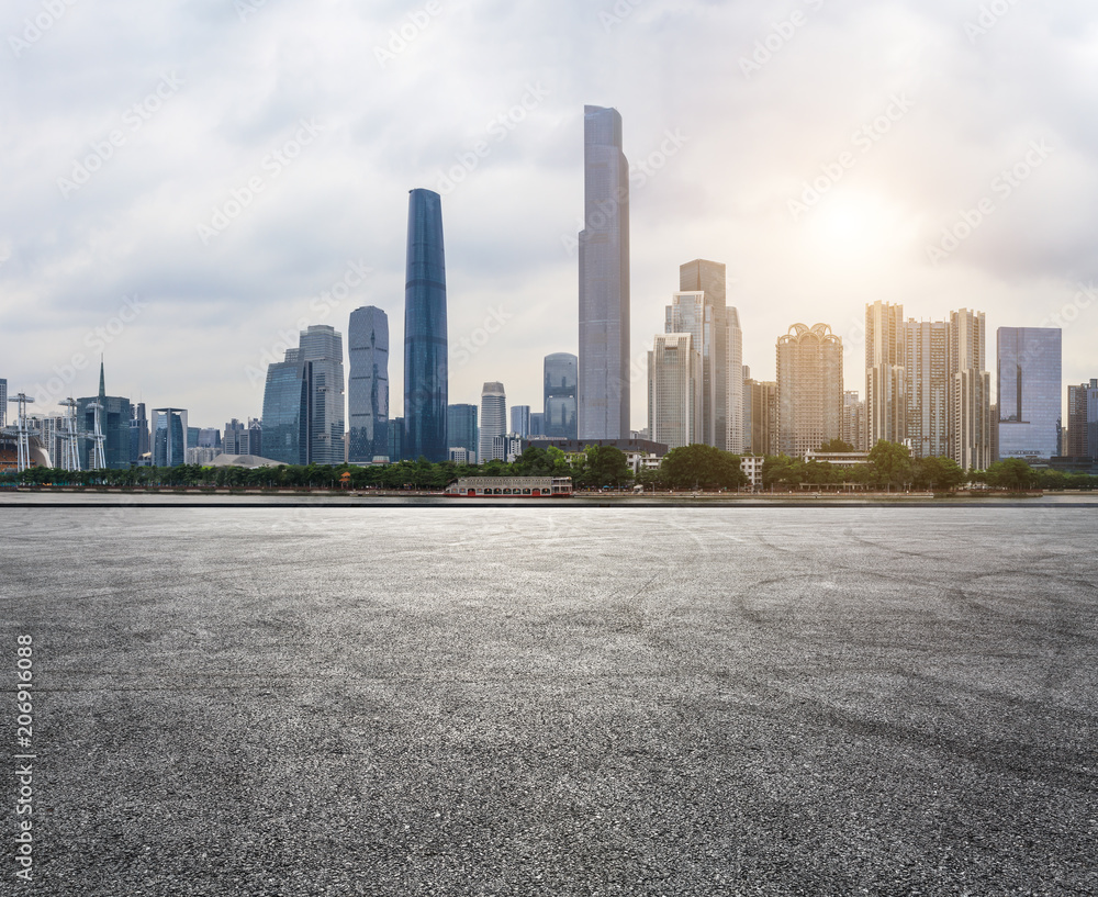 asphalt square road and modern city skyline in Guangzhou at sunset,China