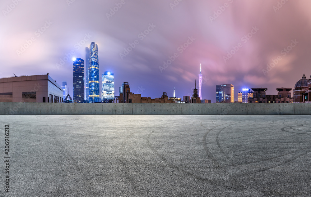 empty asphalt square road and modern city skyline in Guangzhou at night,China