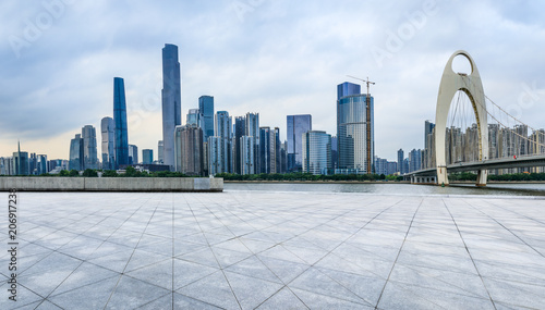 empty square floors and modern city skyline in Guangzhou at dusk,China