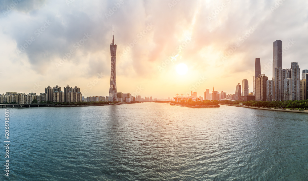 Guangzhou,China modern city skyline panorama on the zhujiang river at sunset