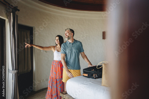 Photography Honeymooners checking in to a hotel room
