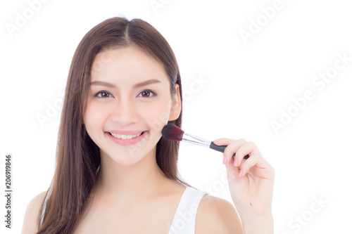 Beauty asian woman applying make up with brush of cheek isolated on white background  beautiful of girl holding blusher  skincare and cosmetic concept.
