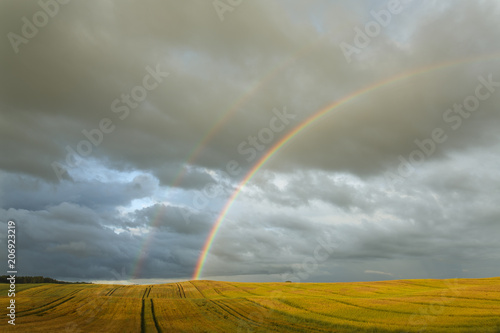 Amazing natural wonders landscape. / Double rainbow with beautiful scenery field in north Poland, Pomeranian voivodeship.