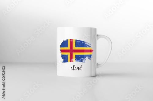 Aland flag souvenir mug on white background. 3D rendering.