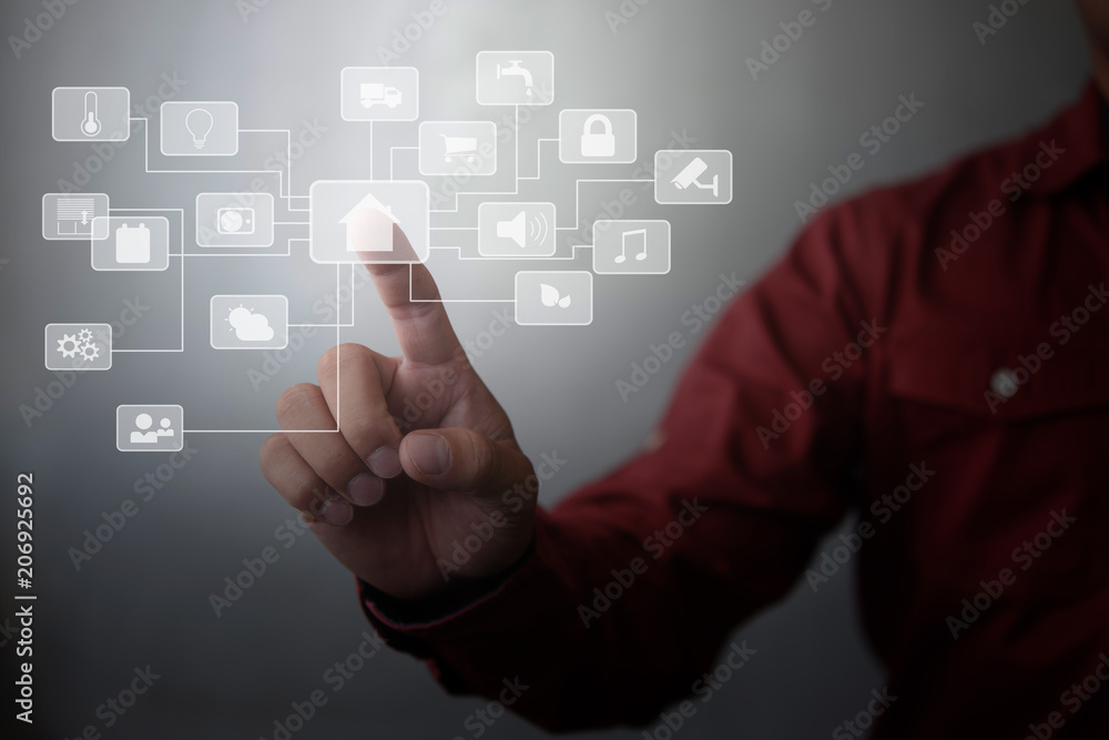 human touching a futuristic interface of smart home on virtual screen. human touching a futuristic interface of smart home on virtual screen.