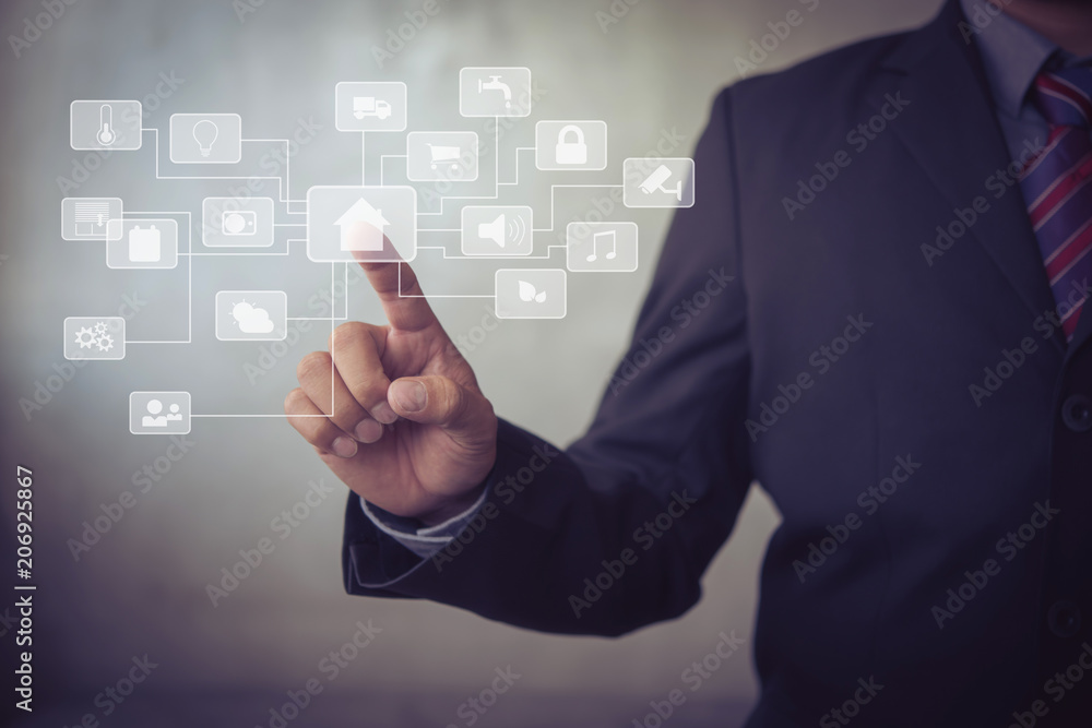 human touching a futuristic interface of smart home on virtual screen. human touching a futuristic interface of smart home on virtual screen.