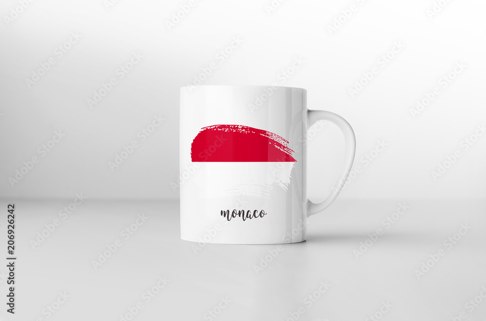 Monaco flag souvenir mug on white background. 3D rendering. Monaco flag souvenir mug on white background. 3D rendering.
