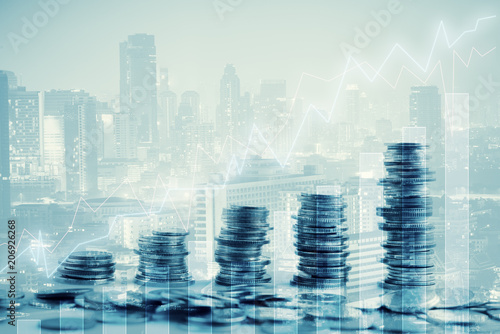 Slika na platnu Double exposure of city and rows of coins for finance and business concept