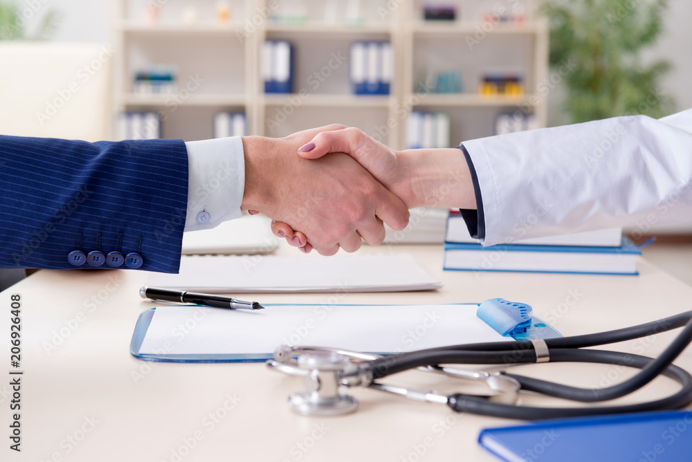 Man signing medical insurance contract Man signing medical insurance contract
