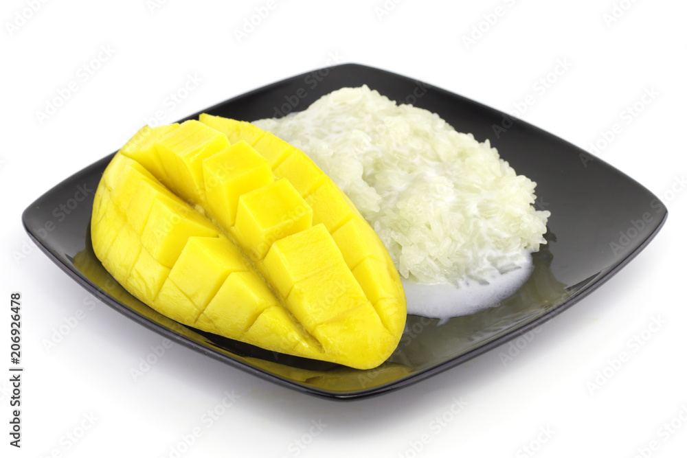 Sweet rice in a plate a yellow ripe sweet beautifulmango fruit and mango slice with cubes isolated white background. Sweet rice in a plate a yellow ripe sweet beautifulmango fruit and mango slice with cubes isolated white background.
