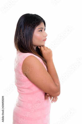 Profile view of young fat Persian teenage girl thinking isolated