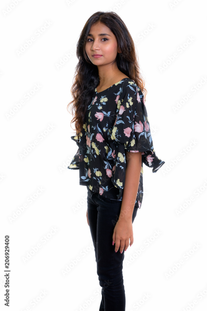 Studio shot of young beautiful Persian woman standing isolated a Studio shot of young beautiful Persian woman standing isolated a