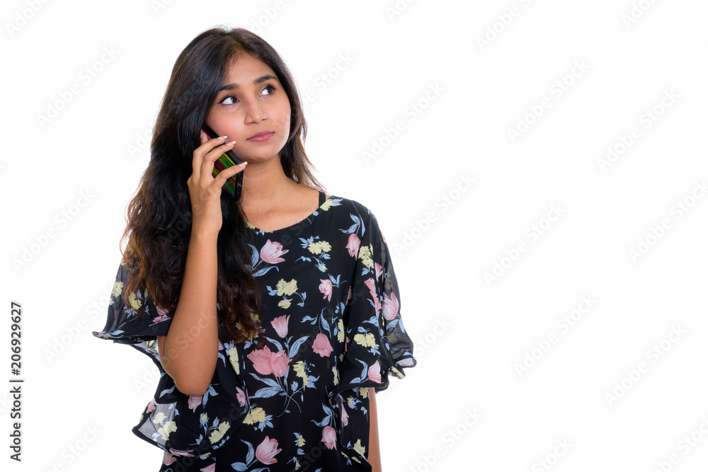 Studio shot of young beautiful Persian woman thinking while talk Studio shot of young beautiful Persian woman thinking while talk