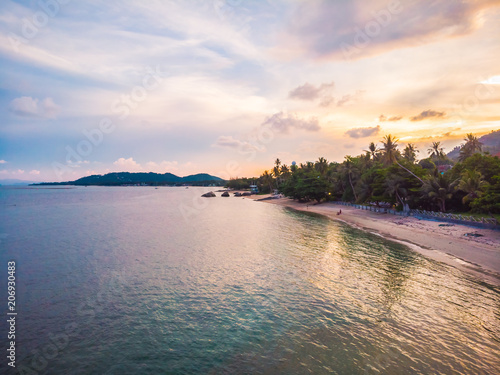 Aerial view of beautiful tropical beach and sea with palm and other tree in koh samui island photo