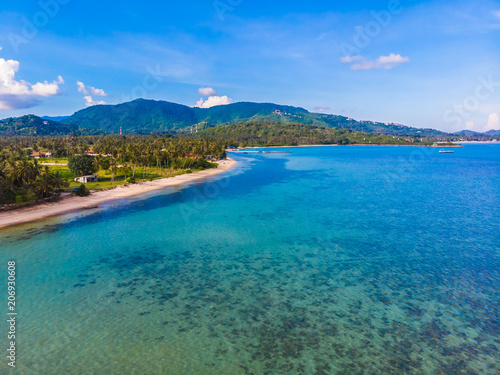 Aerial view of beautiful tropical beach and sea with palm and other tree in koh samui island © siraphol