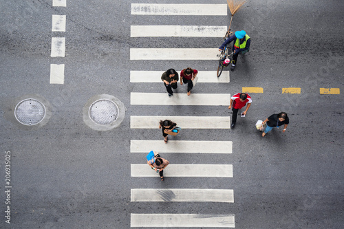 Aerial photo top view of people walk on street in the city over pedestrian crossing traffic road