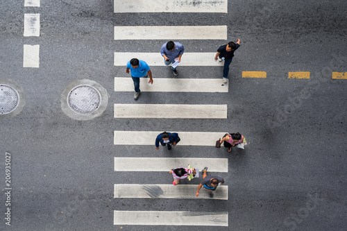 Stampa su Tela Aerial photo top view of people walk on street in the city over pedestrian cross