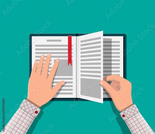 Open book with an upside down page and bookmark.