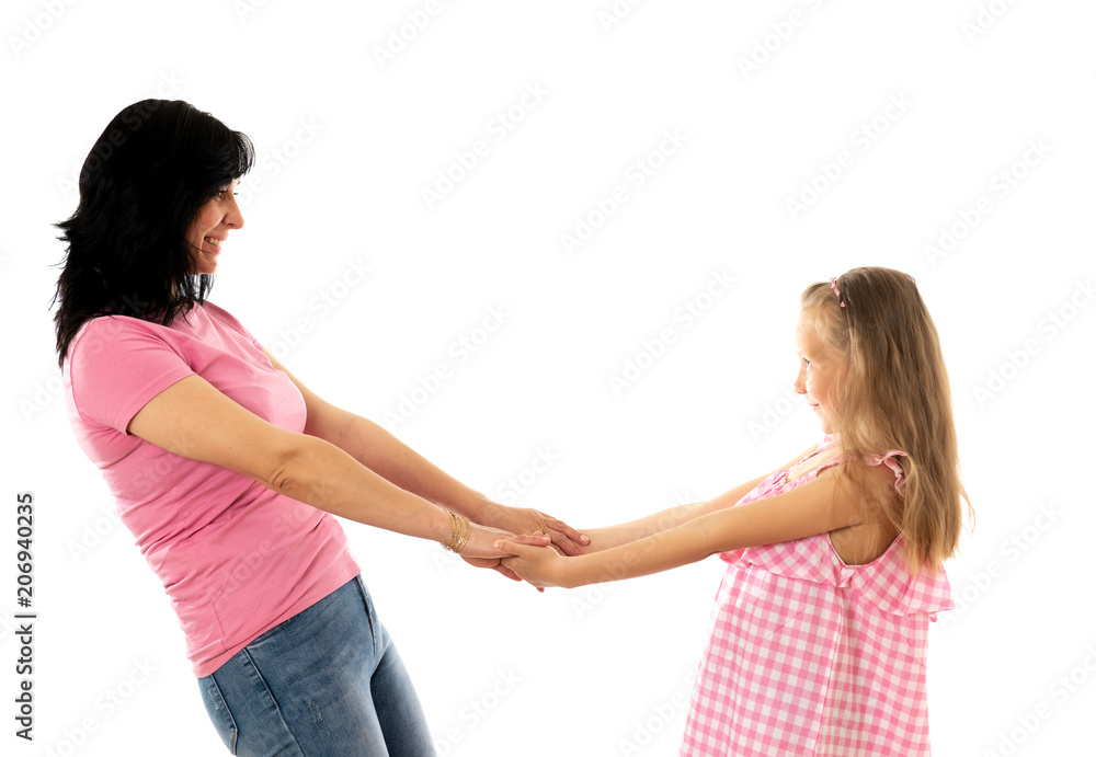 Beautiful young mother and cute charming daughter hugging and playing together. Happy loving family Beautiful young mother and cute charming daughter hugging and playing together. Happy loving family