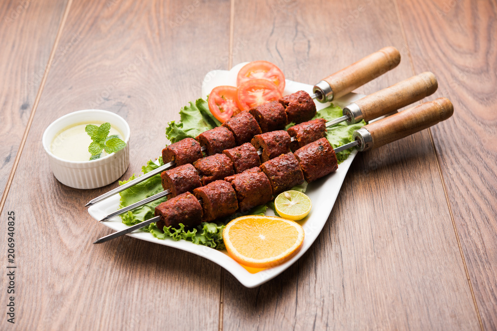 Indian Mutton Seekh Kabab served with green salad, selective focus Indian Mutton Seekh Kabab served with green salad, selective focus