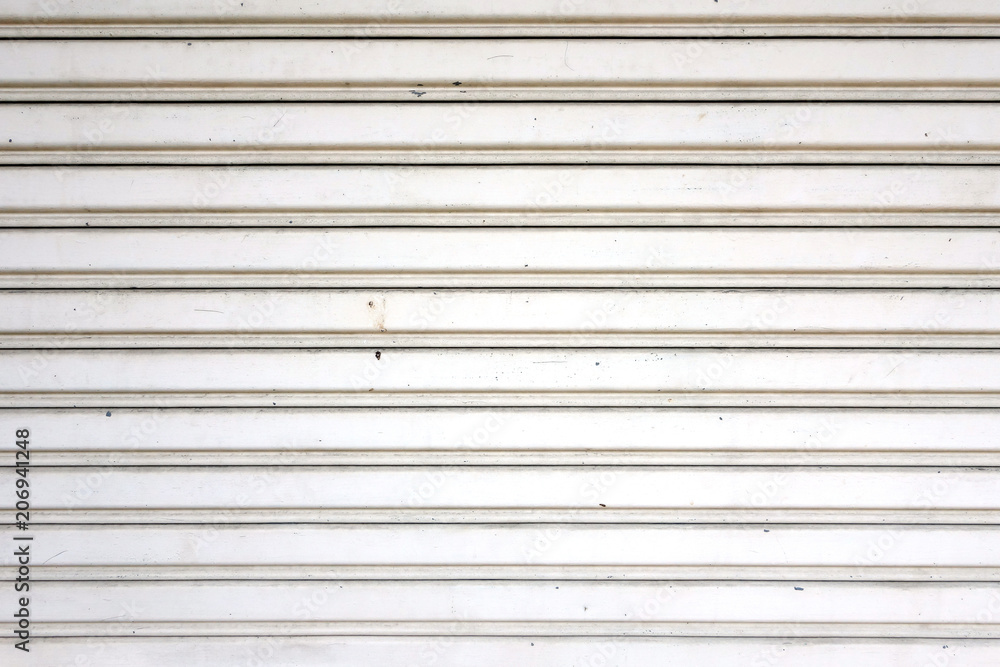 Naklejka premium white metal roller shutter door, corrugated steel sheet texture background