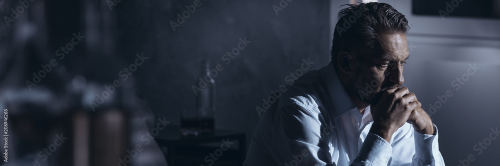 Alcoholic businessman in depression Alcoholic businessman in depression