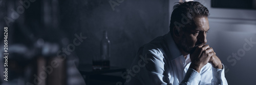 Alcoholic businessman in depression photo