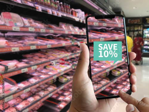 Family in the supermarket use Application of Augmented Reality Supermarket for Discounted or on Sale