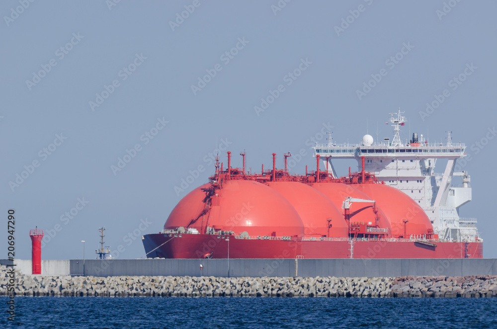 Fototapeta premium LNG TANKER - Red ship enters the port