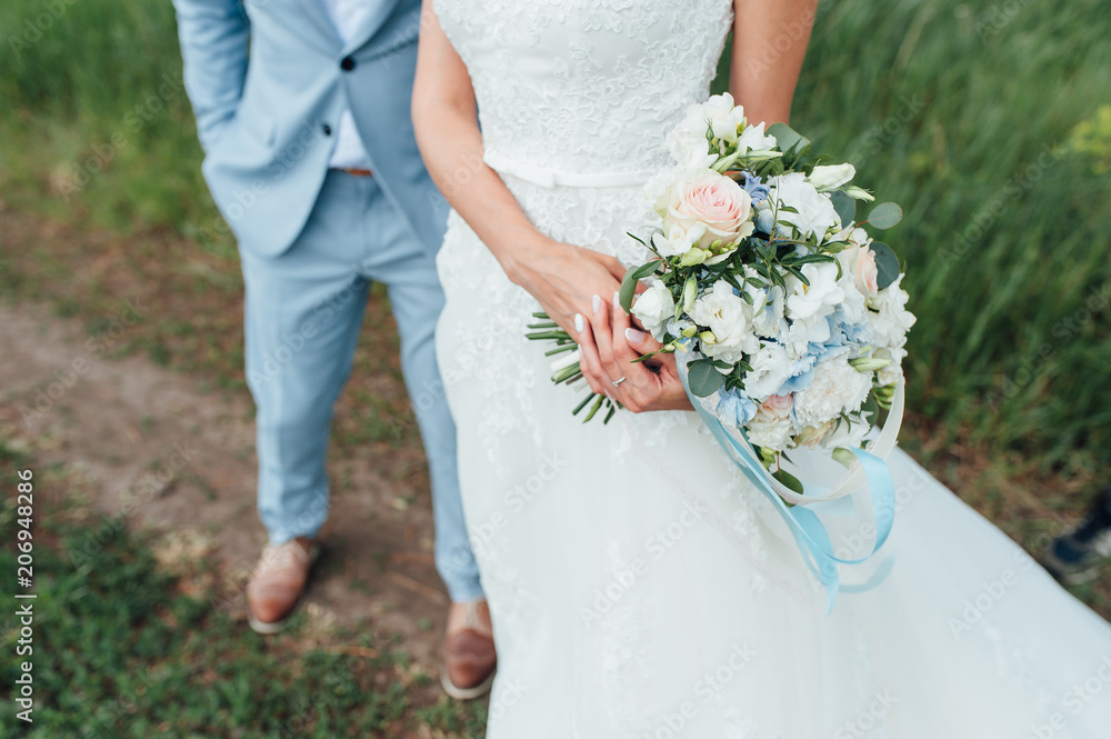 bride in a dress holding a wedding bouquet bride in a dress holding a wedding bouquet