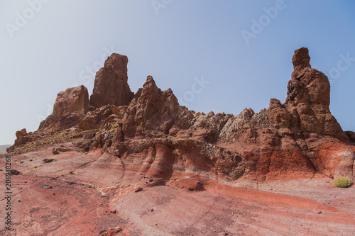 Fantastic martian landscape. Mars surface landscape with explorers in distance. View of the red terrestrial planet