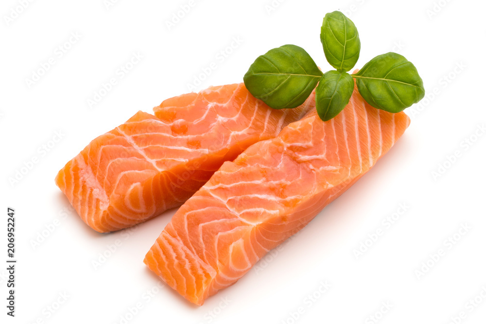 Fresh salmon fillet with basil on the white background. Fresh salmon fillet with basil on the white background.