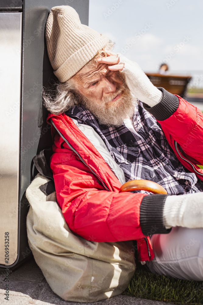 Unsuccessful life. Unhappy bearded man feeling depressed while thinking about his life Unsuccessful life. Unhappy bearded man feeling depressed while thinking about his life