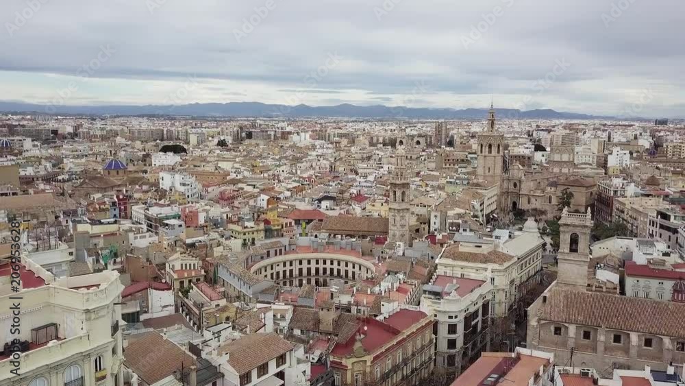 Spain, Valencia aerial shooting, bird-eye view on red roofs and squares, and roads. beautiful buildings and streets, view from the sky Spain, Valencia aerial shooting, bird-eye view on red roofs and squares, and roads. beautiful buildings and streets, view from the sky