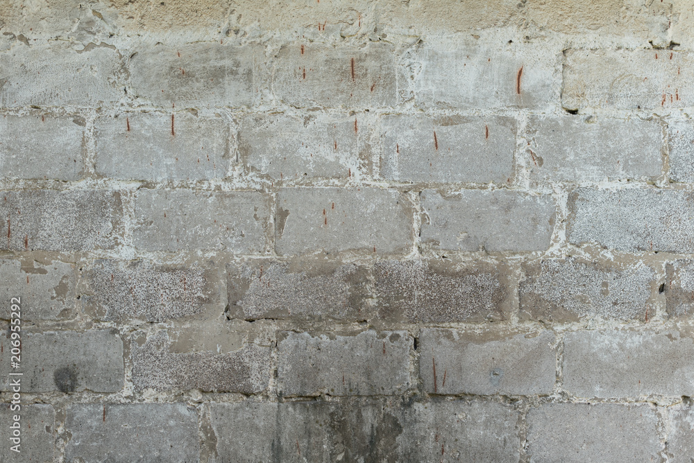 Fototapeta premium Brick texture with scratches and cracks