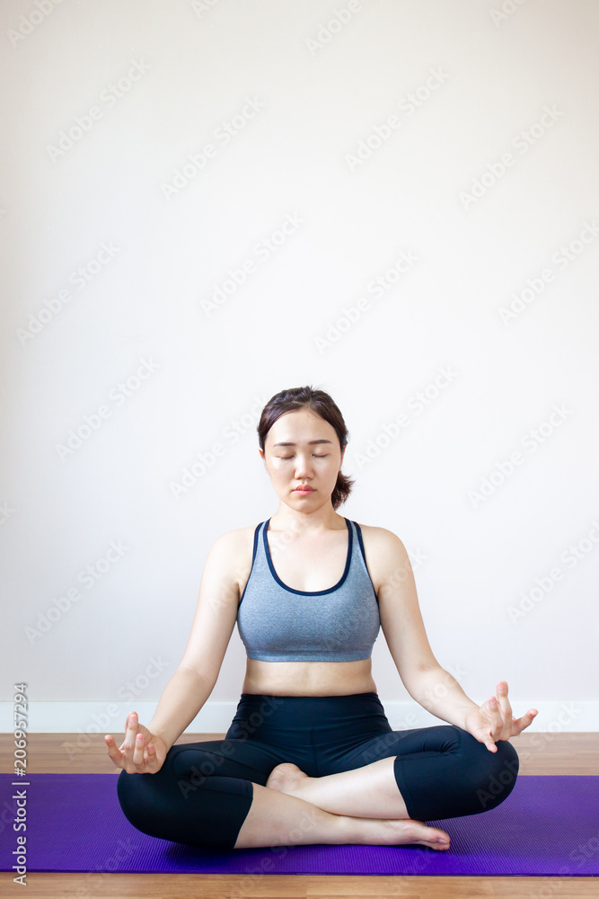 Asian women doing Yoga exercise. Concept of healthy women in modern life. Asian women doing Yoga exercise. Concept of healthy women in modern life.