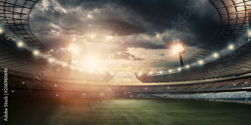 Stadium in the lights and flashes, football field. Concept sports background, football, night stadium. Mixed media, copy space. photo