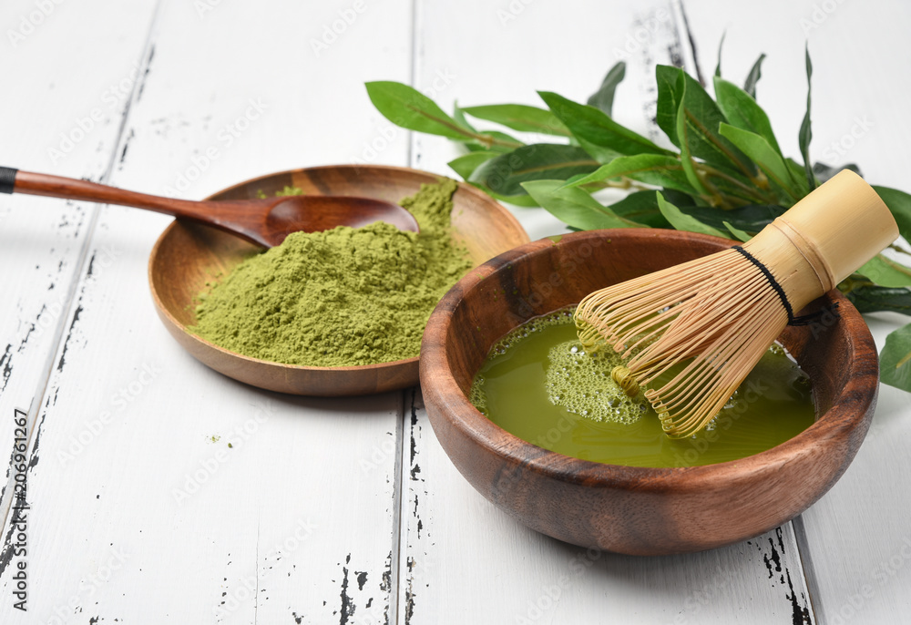 Japanese green tea matcha in a wooden bowl Japanese green tea matcha in a wooden bowl
