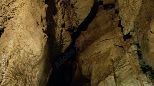 Lit New Zealand cave from wooden viewing platform