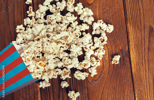 Salt popcorn on the wooden table