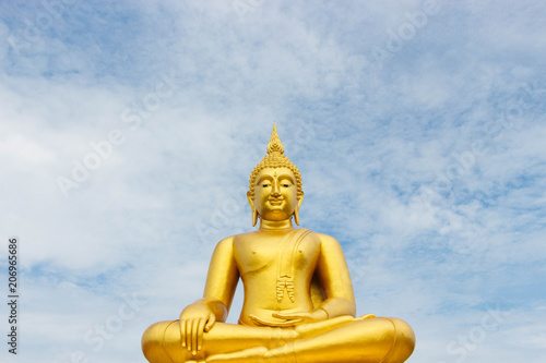 Great Golden Buddha statue in the sky in the daytime.