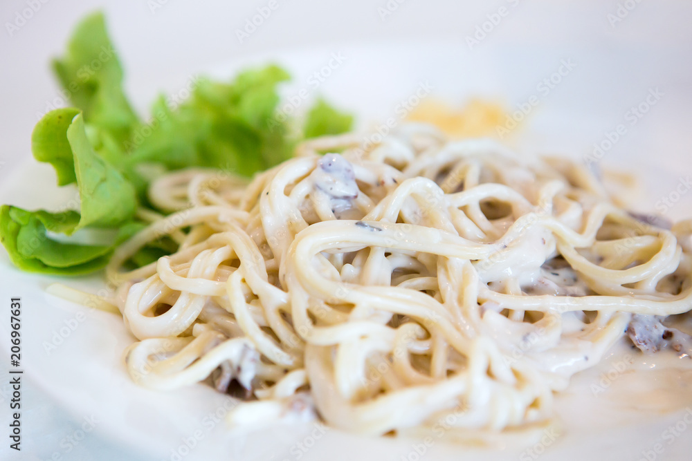 Kids are eating delicious spaghetti. Kids are eating delicious spaghetti.