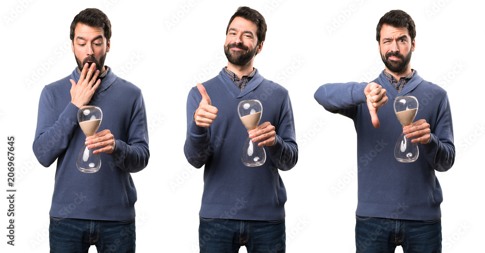Set of Happy Handsome brunette man with beard holding a sand clock Set of Happy Handsome brunette man with beard holding a sand clock