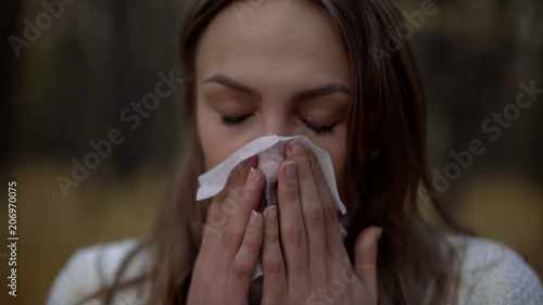 Woman suffering from runny nose, poor immunity in cold weather season, health