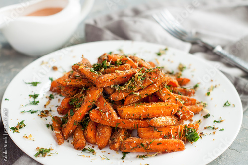 Baby carrots roasted with parmesan and herbs photo