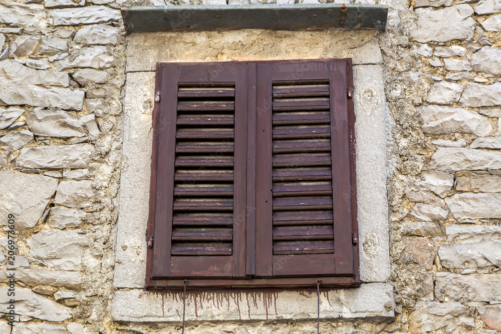 Close up of typical brown window in Istria - Croatia Close up of typical brown window in Istria - Croatia