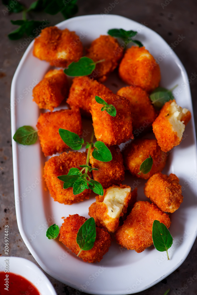Halloumi Nuggets with Marinara Dipping Sauce.selective focus Halloumi Nuggets with Marinara Dipping Sauce.selective focus